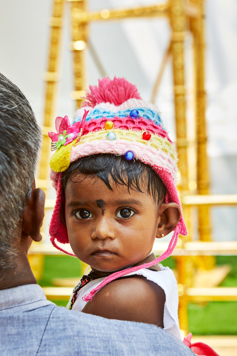 Young-girl-with-colourul-hat-Wel-Bhodhiya-Sri-Lanka-web